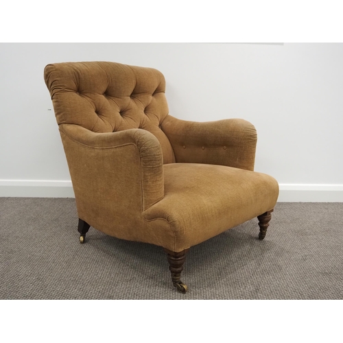 332 - Howard & Sons Ltd armchair. Sat on turned mahogany legs with stamped brass castors. This armchair ha... 