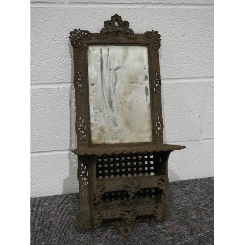 30 - Cast iron wall mounted mirror with shelf for lamp and matches