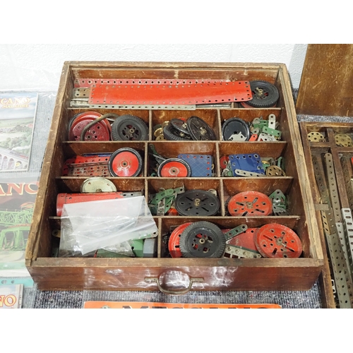 57 - Vintage Meccano parts in wooden drawer and Meccano literature to include instruction books and magaz... 