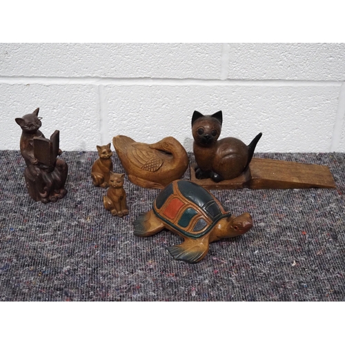 58 - Carved wooden animals to include cat doorstop, turtle, etc.