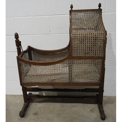421 - Antique cane and mahogany cradle