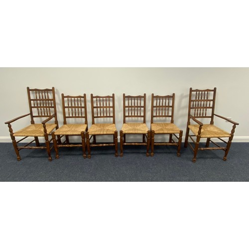 315 - Set of 6 spindle back dining chairs in oak with rush seats