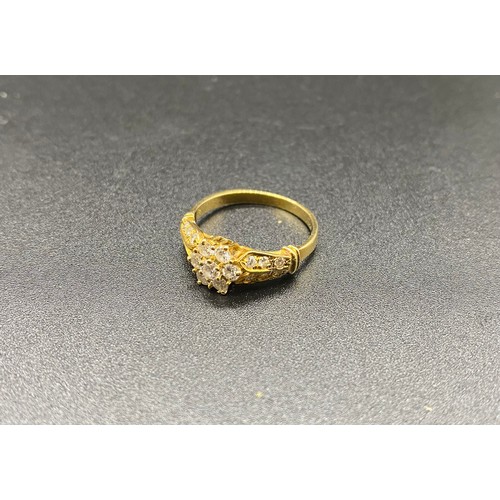 231 - Believed 18ct yellow gold and diamond set daisy cluster ring. The centre stone approx. 10 points. Ap... 