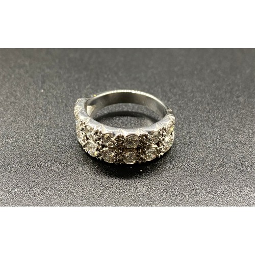 232 - White metal double half eternity ring, set with 14, 15-20 point diamonds. Approx. 8.1g