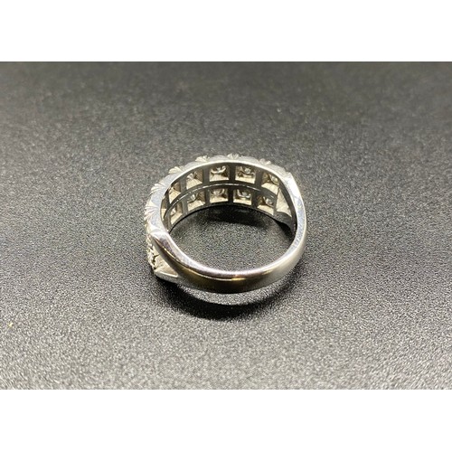 232 - White metal double half eternity ring, set with 14, 15-20 point diamonds. Approx. 8.1g