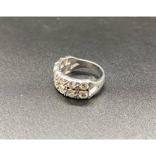 232 - White metal double half eternity ring, set with 14, 15-20 point diamonds. Approx. 8.1g