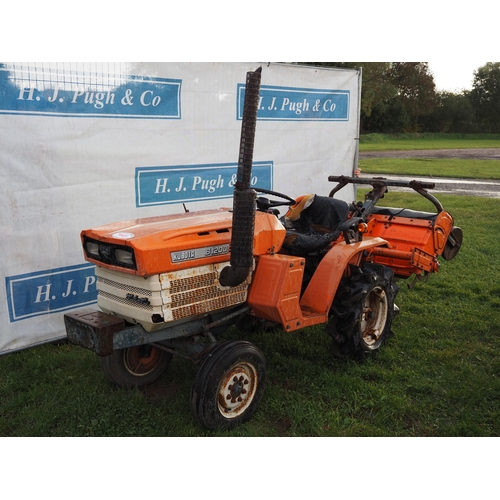 1441 - Kubota B1200 compact tractor with 4ft rotavator attached. Runs but has a flat battery. 1159 hours sh... 
