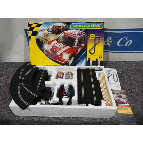 452 - Scalextric John Cooper challenger set in box with controllers, adapter and 2 cars