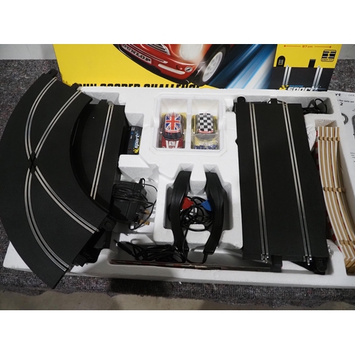 452 - Scalextric John Cooper challenger set in box with controllers, adapter and 2 cars