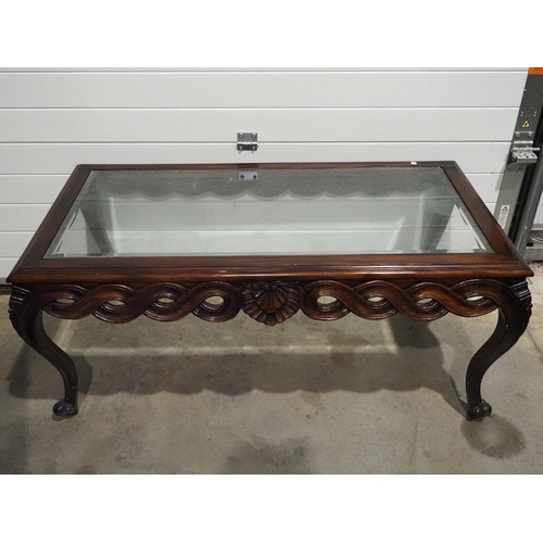 605 - Carved mahogany coffee table with glass top 53