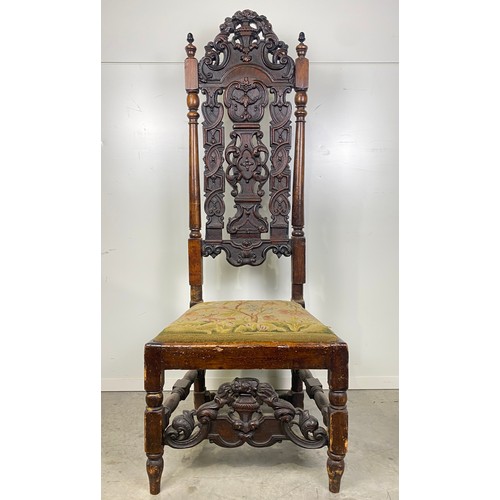 602 - Antique heavily carved high back chair with tapestry seat