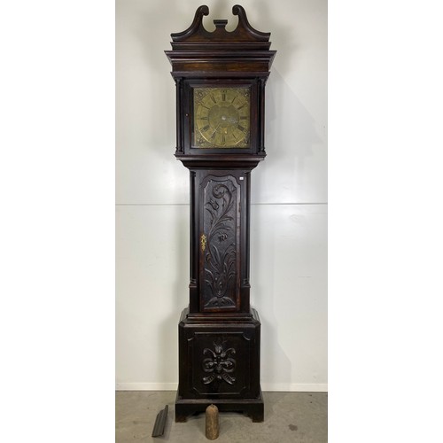 562 - 18th Century carved oak long case clock by Jonathan Lees of Bury with brass face H86