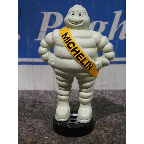 1607 - Cast Iron Michelin man on tyre 13