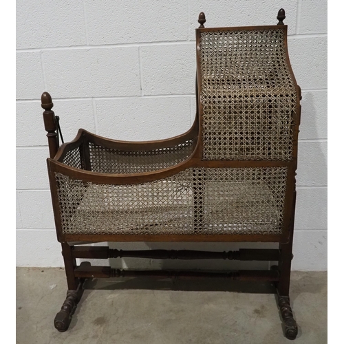 613 - Antique cane and mahogany cradle