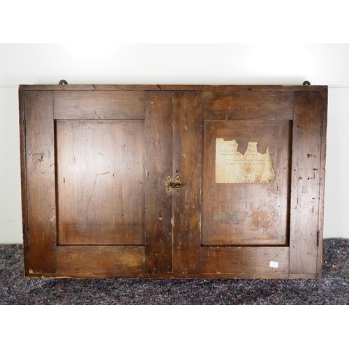 545 - Antique wall mounted cabinet to hold rules