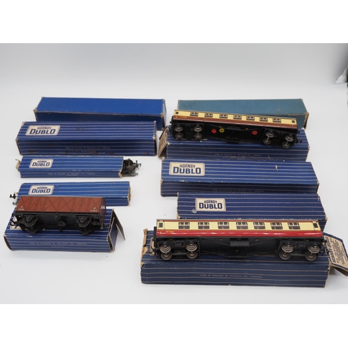 36 - Assorted Hornby OO gauge boxed wagons and carriages to include Bogie Well wagon and corridor coach
