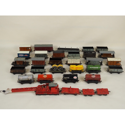 49 - Assorted Hornby OO gauge No.133 crane and wagons to include Esso and Shell oil tankers