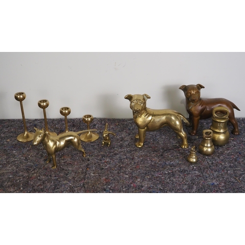 425 - Assorted brass items to include weights, candle sticks, etc.