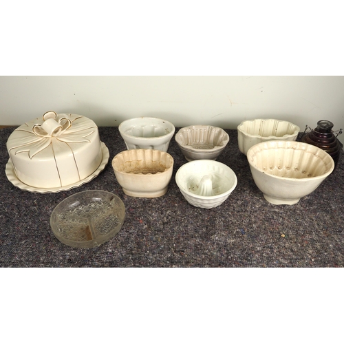 487 - Assorted china jelly moulds, cake dish, etc.