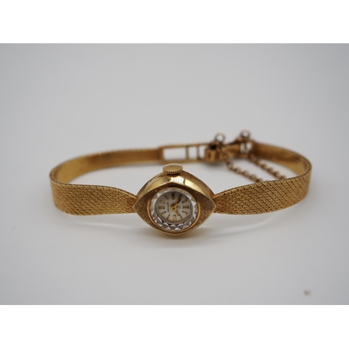 283 - 14ct Gold bracelet watch