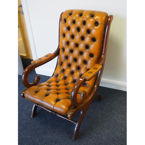 521 - Chesterfield style leather arm chair with mahogany frame