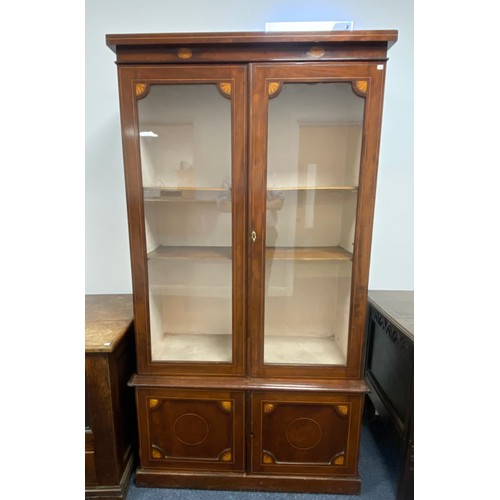 512 - Victorian bookcase with glazed top section and cupboard to the base with satin wood inlay.  H71½