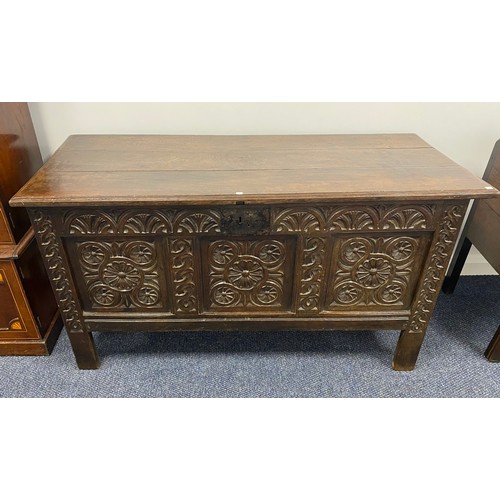 513 - Georgian heavily carved oak coffer with 3 plank top and on 4 legs. H30