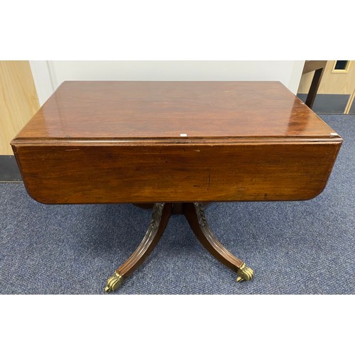 517 - 19th Century Pembroke table with carved pedestal base on brass casters. Having 1 real and 1 dummy dr... 