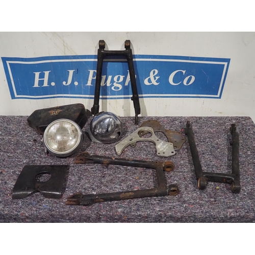 93 - Matchless/ AMC spares to include headlamps, swinging arms, battery box cover, etc.
