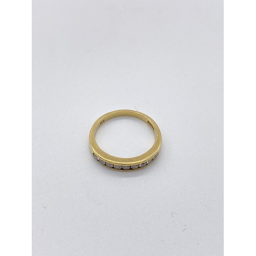 419 - 18ct Yellow gold 9 stone channel set diamond eternity ring. Approx. 4.1g