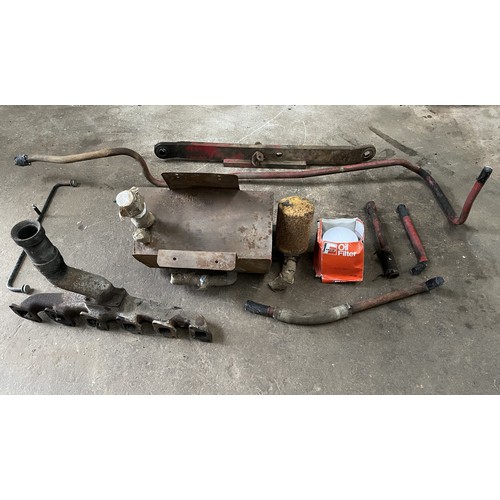 227 - International 955 and 1055 spares to include exhaust manifold, rear window supports, hydraulic oil t... 