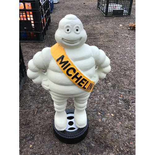 883 - Cast iron Michelin man on tyre 13