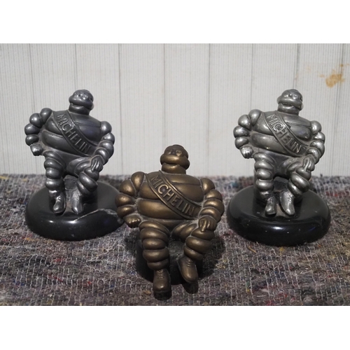 515 - Metal Michelin man paperweights 4