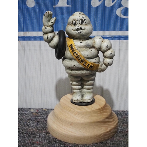 516 - Cast Michelin man on wooden plinth 8½