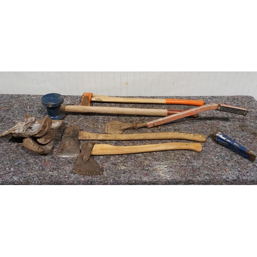 651 - Assorted hand tools to include fencing hammer, mitten, axes, etc.