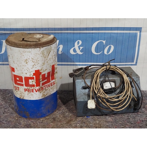 688 - Vintage battery charger and 25 litres of rust preventative