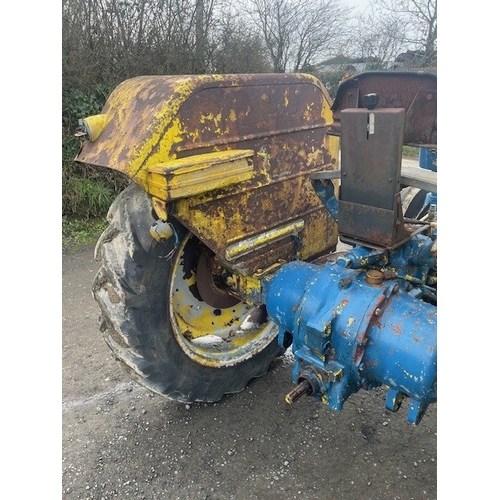 570E - Ford 4000 tractor. Runs and drives. Fitted with front bonnet guard, disc brakes and County rear fend... 