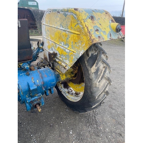 570E - Ford 4000 tractor. Runs and drives. Fitted with front bonnet guard, disc brakes and County rear fend... 