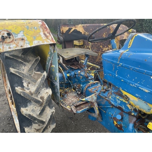 570E - Ford 4000 tractor. Runs and drives. Fitted with front bonnet guard, disc brakes and County rear fend... 