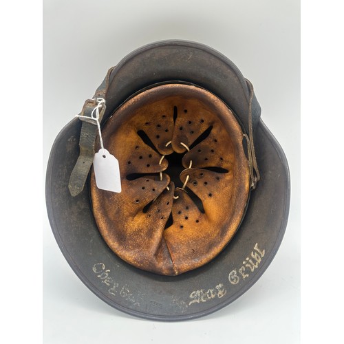 363 - German Luftwaffe M40 helmet by ET64 with soldier name on the neck