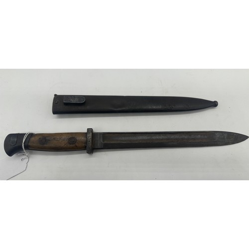 384 - German bayonet with wooden grip and various stamps