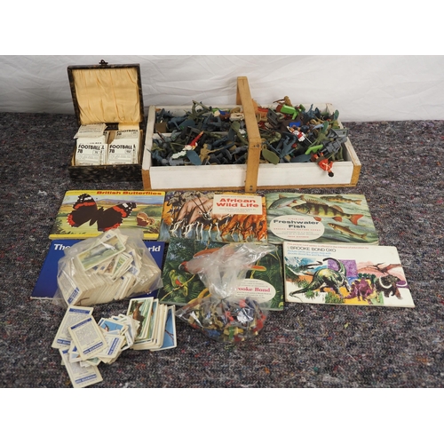 102 - Quantity of toy soldiers, cigarette cards, football cars and wildlife booklets