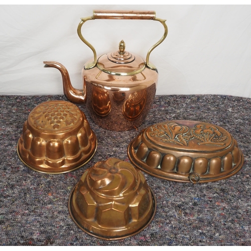 229 - Copper kettle and 3 jelly moulds