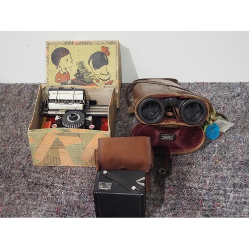 140 - Racing binoculars in leather case, Brownie camera and vintage childs typewriter