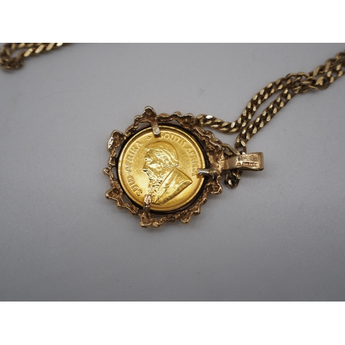 329 - 1/10th Oz 22ct gold Krugerrand 1981 in 9ct gold chain. Total weight approx. 12.2g