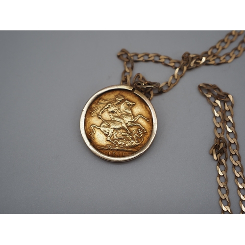 320 - Gold sovereign 1911 in 9ct gold chain and clasp. Total weight approx. 15.4g