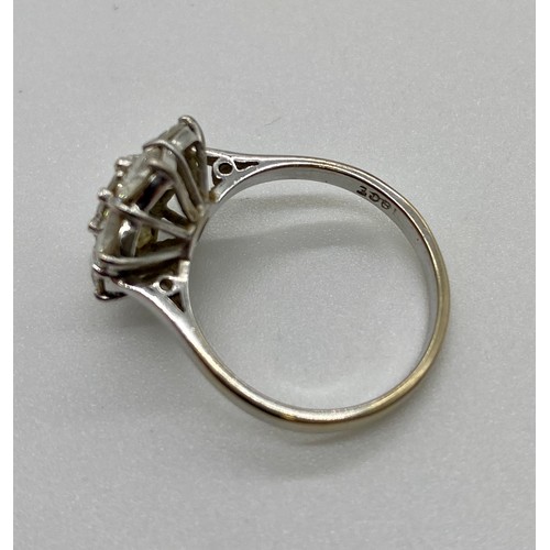 337A - 18ct White gold 7 stone diamond daisy cluster ring claw set. The center stone is approx. 50 points s... 