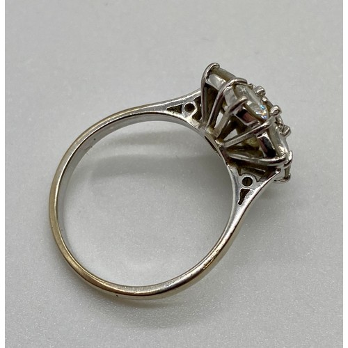 337A - 18ct White gold 7 stone diamond daisy cluster ring claw set. The center stone is approx. 50 points s... 