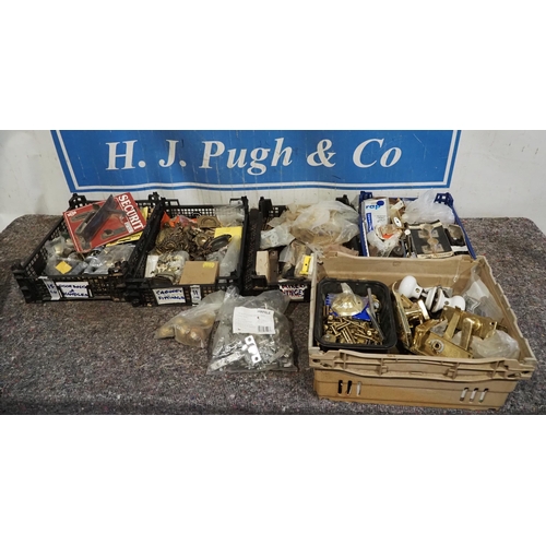 657 - Large quantity of door fixings, knobs, brass fittings, etc.