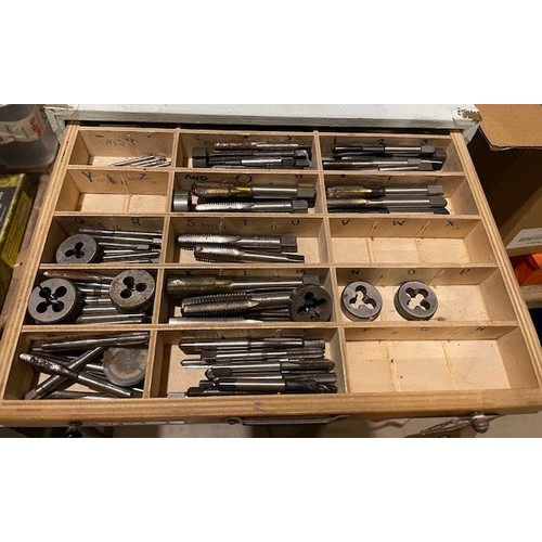 695 - Wooden 9 drawer unit and contents to include over 250 taps and dies in different sizes